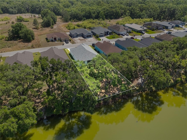 birds eye view of property featuring a residential view and a water view