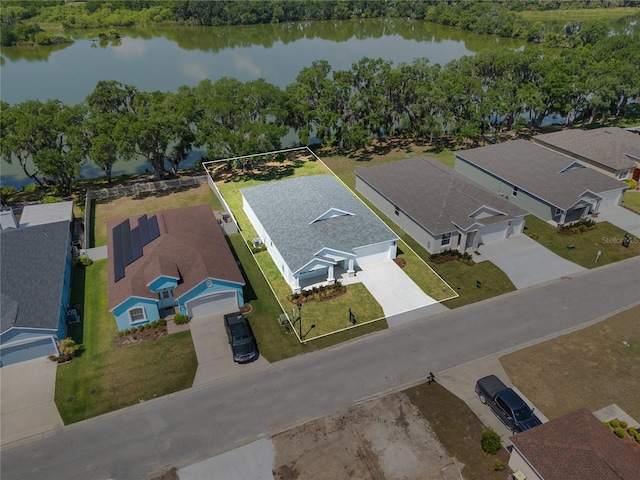 birds eye view of property featuring a residential view and a water view
