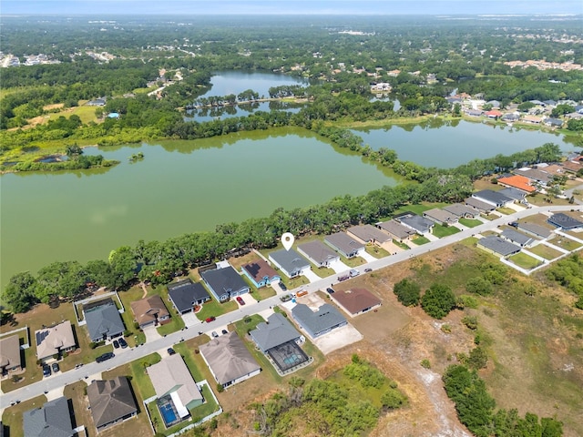 birds eye view of property with a water view and a residential view