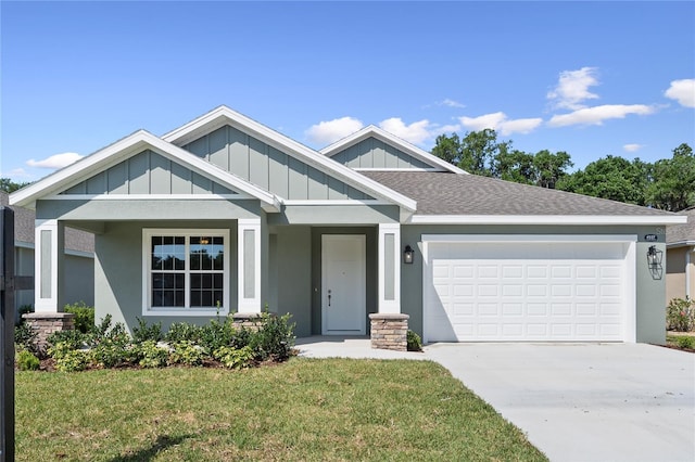 4537 Fairway Oaks Dr, Mulberry, FL 33860 - craftsman-style house with concrete driveway, board and batten siding, a front lawn, an attached garage, and a shingled roof