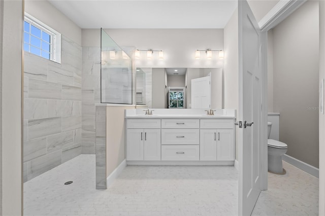 4537 Fairway Oaks Dr, Mulberry, FL 33860 - full bathroom featuring a walk in shower, double vanity, a sink, and baseboards