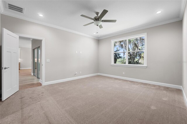 4537 Fairway Oaks Dr, Mulberry, FL 33860 - spare room with visible vents, light colored carpet, ornamental molding, and ceiling fan