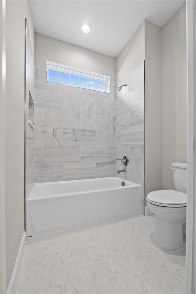 4537 Fairway Oaks Dr, Mulberry, FL 33860 - full bathroom with toilet, tub / shower combination, baseboards, and marble finish floor