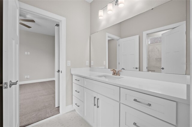 4537 Fairway Oaks Dr, Mulberry, FL 33860 - bathroom with vanity, baseboards, and a ceiling fan