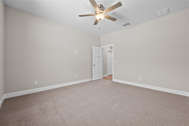 4537 Fairway Oaks Dr, Mulberry, FL 33860 - carpeted empty room featuring baseboards, a ceiling fan, and visible vents