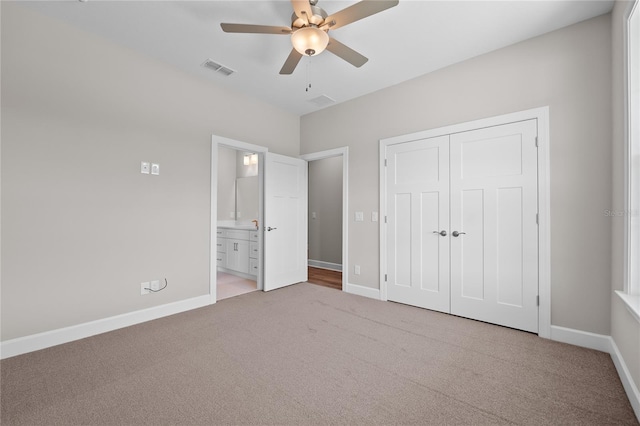 4537 Fairway Oaks Dr, Mulberry, FL 33860 - unfurnished bedroom with a closet, ensuite bathroom, light colored carpet, and baseboards