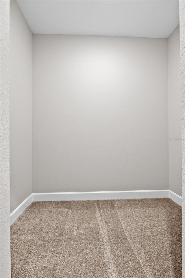 4537 Fairway Oaks Dr, Mulberry, FL 33860 - carpeted empty room with baseboards