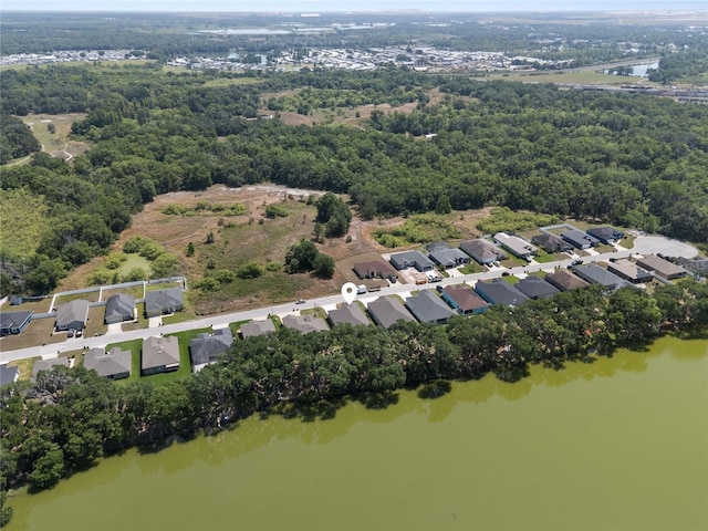 4537 Fairway Oaks Dr, Mulberry, FL 33860 - drone / aerial view featuring a view of trees, a residential view, and a water view