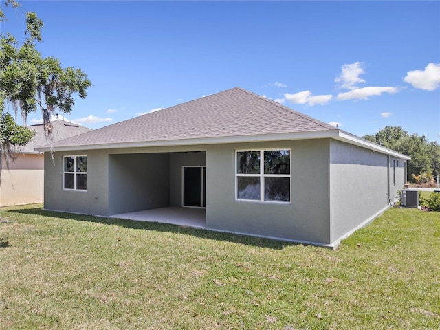 4537 Fairway Oaks Dr, Mulberry, FL 33860 - back of property with central air condition unit, stucco siding, a lawn, a patio, and a shingled roof