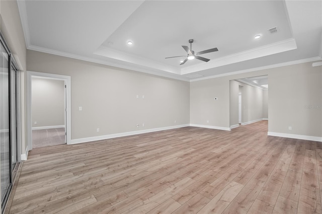 4537 Fairway Oaks Dr, Mulberry, FL 33860 - interior space with crown molding, light wood-style floors, visible vents, a tray ceiling, and ceiling fan