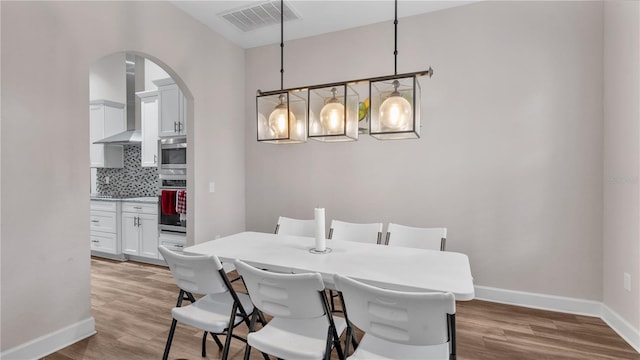 dining space featuring light hardwood / wood-style floors