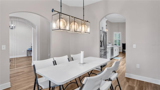 dining space featuring light hardwood / wood-style floors