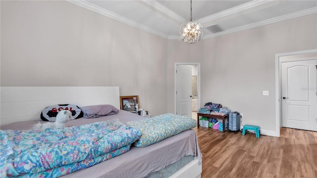 bedroom with a notable chandelier, ornamental molding, and wood-type flooring