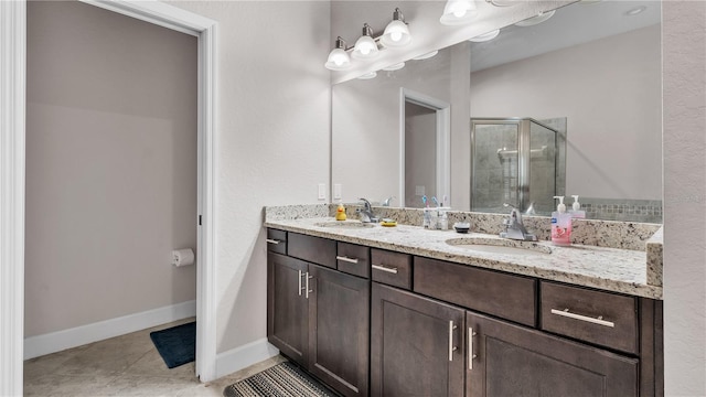 bathroom with double vanity and tile patterned floors