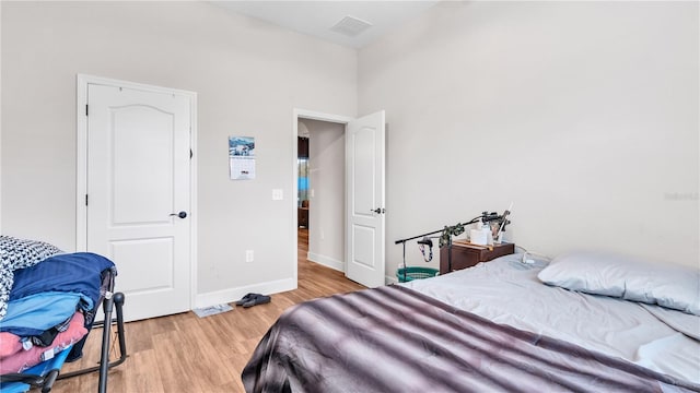 bedroom with light hardwood / wood-style flooring