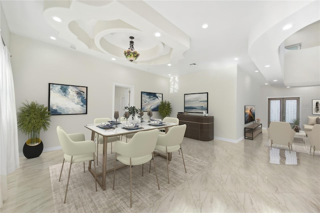 dining space with recessed lighting, baseboards, marble finish floor, french doors, and a tray ceiling