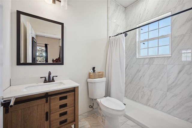 full bath with toilet, marble finish floor, a tile shower, and vanity