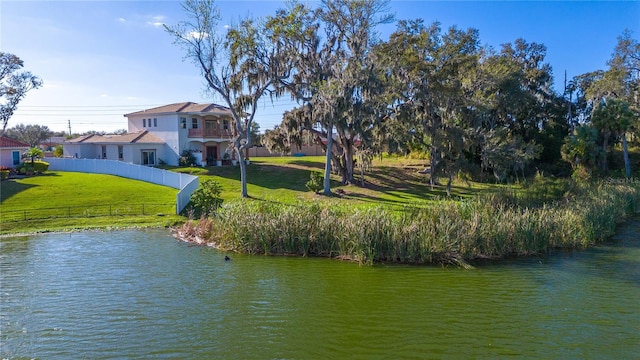 view of water feature with fence