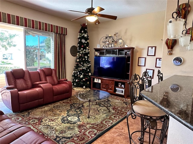 tiled living room featuring a textured ceiling and ceiling fan