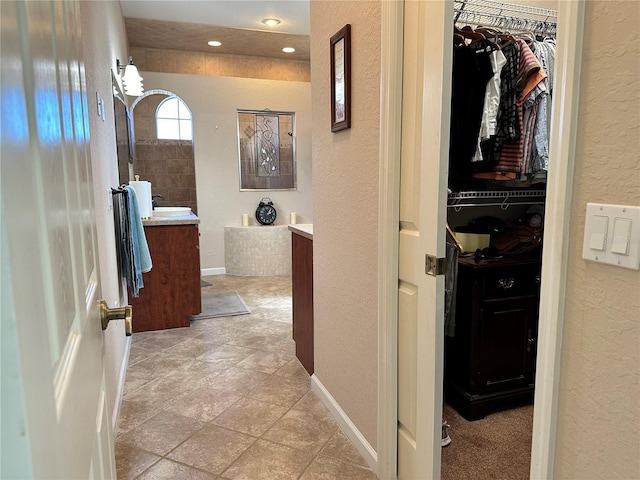 hallway with light tile floors