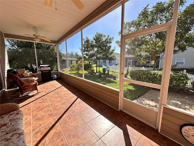 sunroom / solarium with ceiling fan