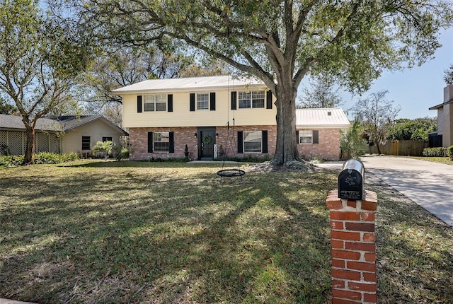 view of front of property with a front lawn