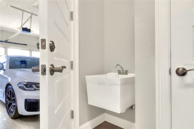 bathroom featuring washer / dryer and sink