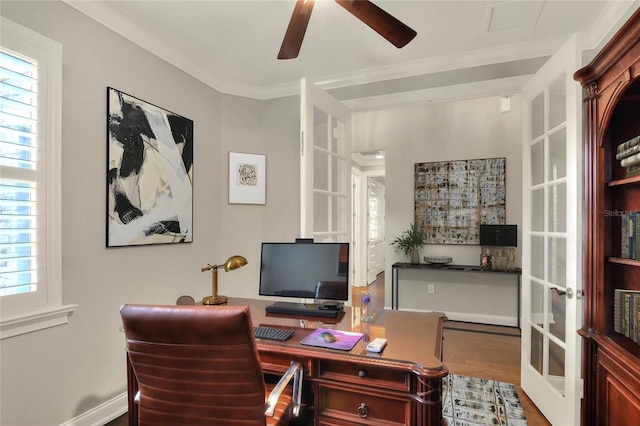 office space featuring french doors, plenty of natural light, crown molding, and hardwood / wood-style flooring