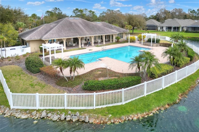 view of pool featuring a water view, a pergola, and a patio