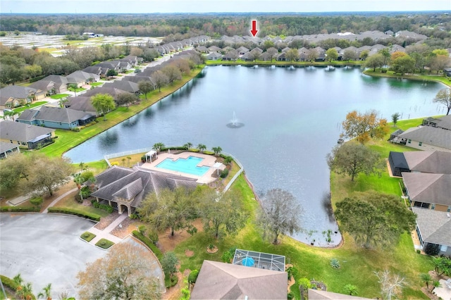 birds eye view of property with a water view