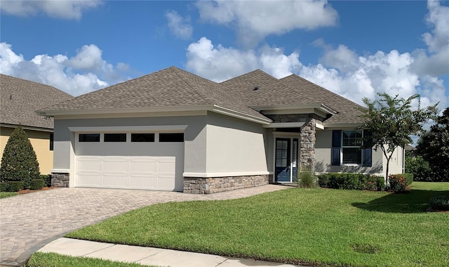 view of front of house with a garage and a front yard