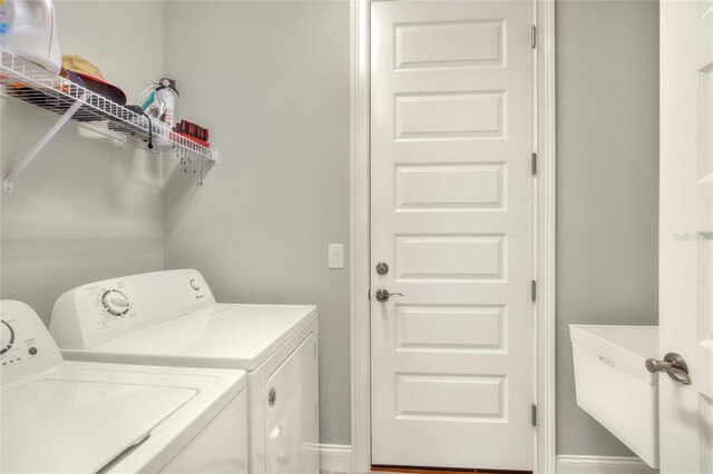 laundry room featuring washing machine and clothes dryer