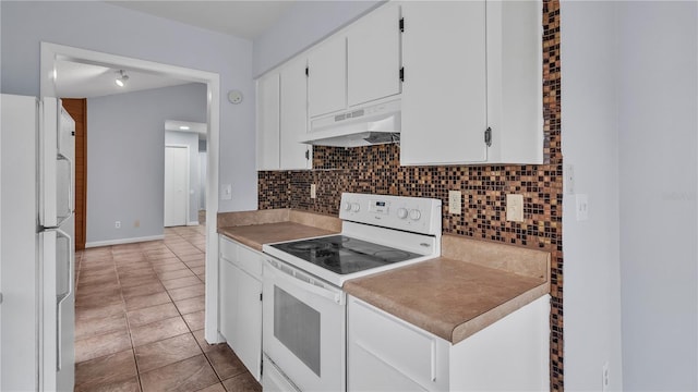 kitchen with white cabinetry, backsplash, white appliances, premium range hood, and light tile floors