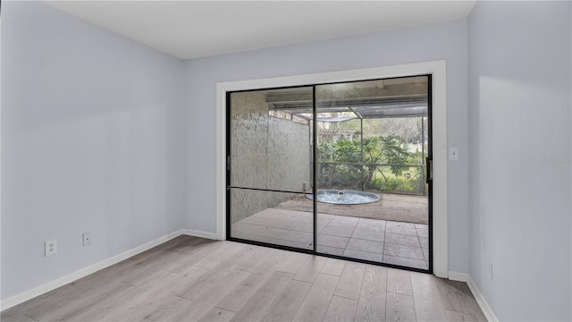 empty room with light hardwood / wood-style floors