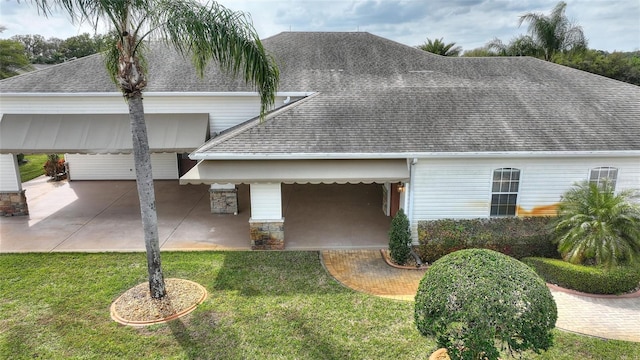 view of property with a front yard and a patio