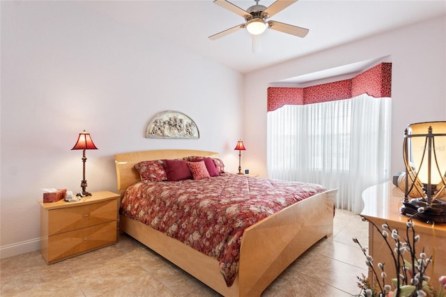 bedroom featuring ceiling fan and light tile floors