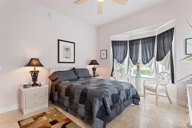 tiled bedroom with ceiling fan