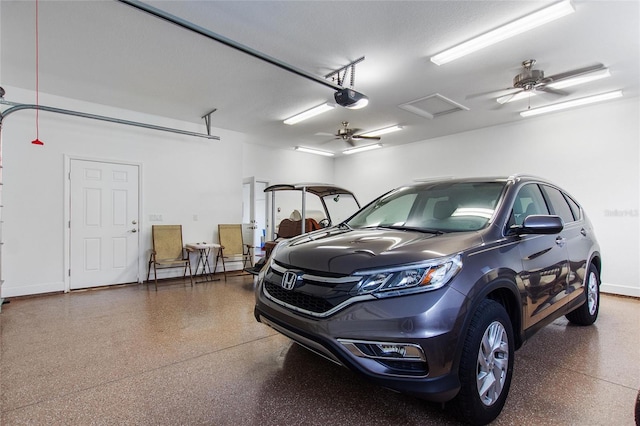 garage featuring ceiling fan and a garage door opener