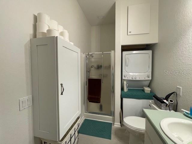 bathroom featuring toilet, walk in shower, and vanity