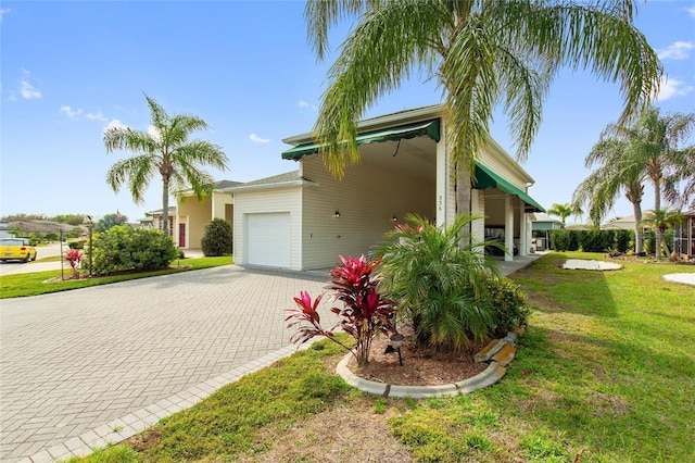 view of property exterior featuring a lawn and a garage