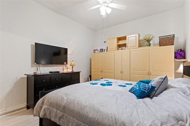 bedroom featuring light hardwood / wood-style floors and ceiling fan