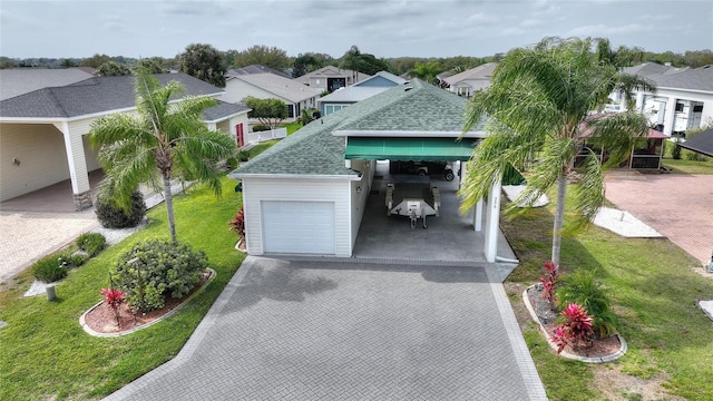 view of front facade featuring a front yard and a garage