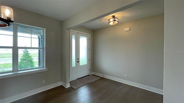 532 Adams View Ln, Auburndale, FL 33823 - foyer entrance featuring baseboards, dark wood-style flooring, and visible vents