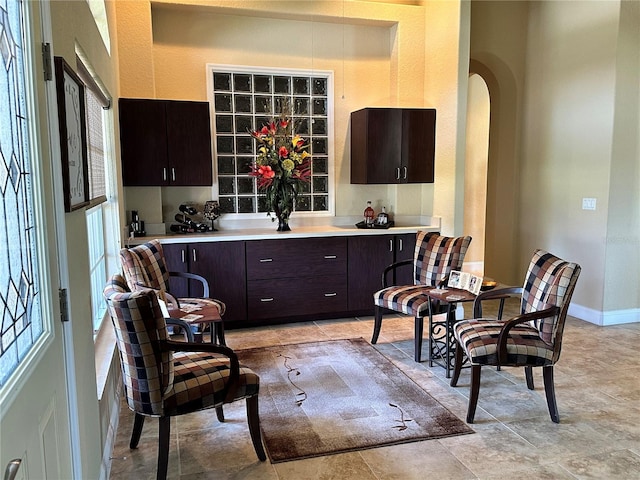 sitting room with light tile flooring