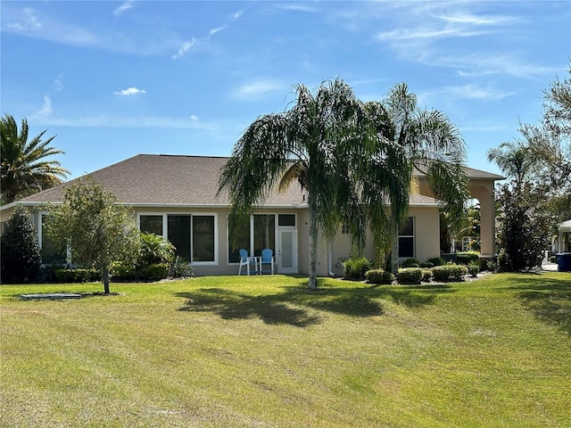 ranch-style house with a front yard