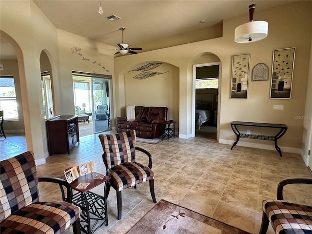 interior space featuring plenty of natural light, ceiling fan, and light tile floors