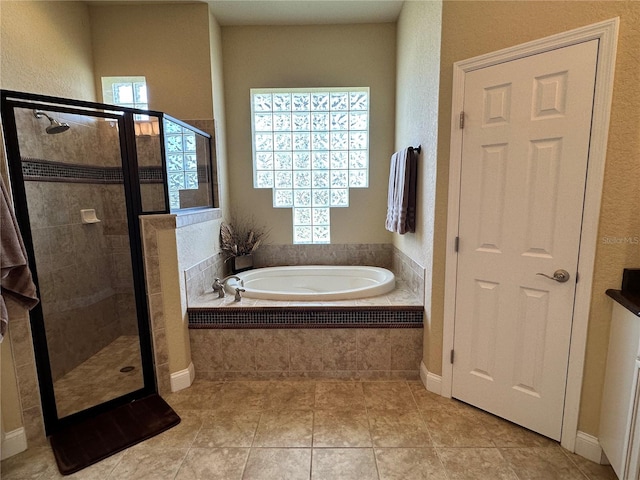 bathroom with tile floors and plus walk in shower