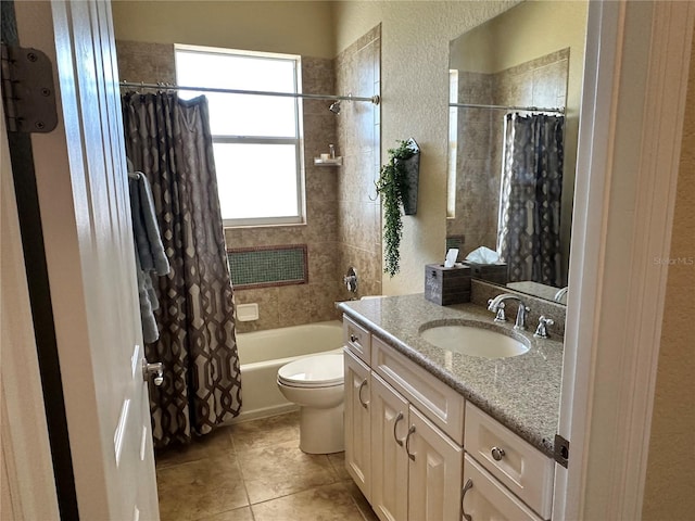 full bathroom with tile floors, vanity, toilet, and shower / bathtub combination with curtain