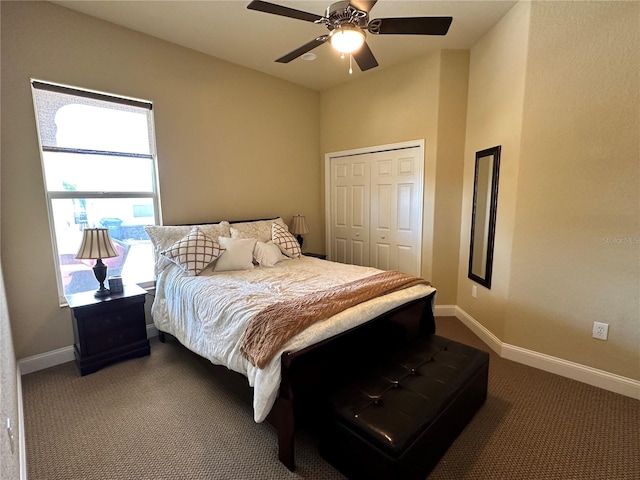 carpeted bedroom featuring a closet and ceiling fan