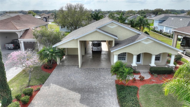 view of front of home with a carport